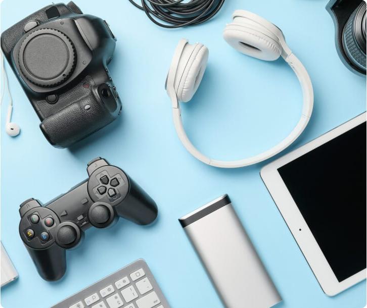 Various electronic devices on a blue table